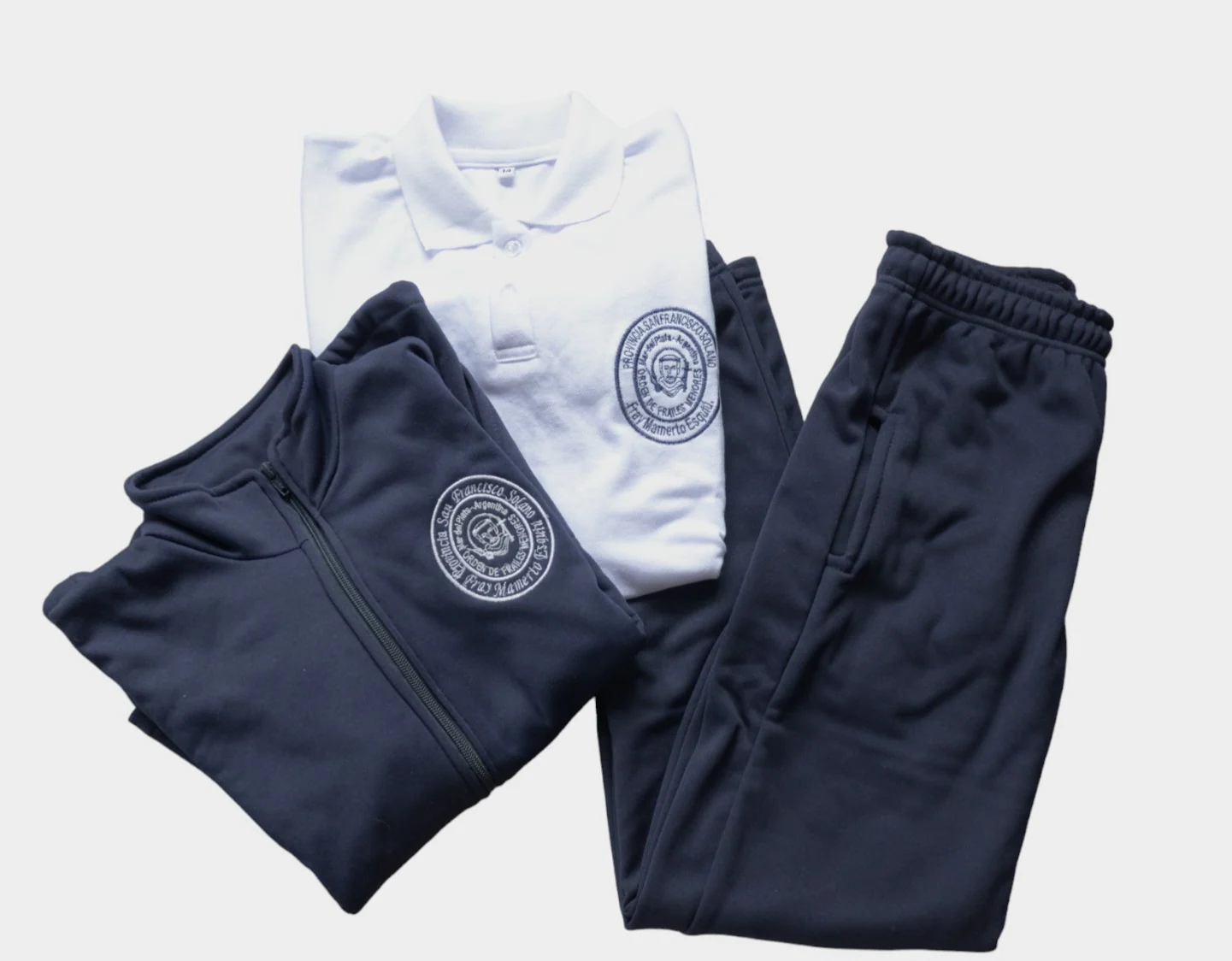 Conjunto Esquiú con chomba, campera y pantalón azul marino